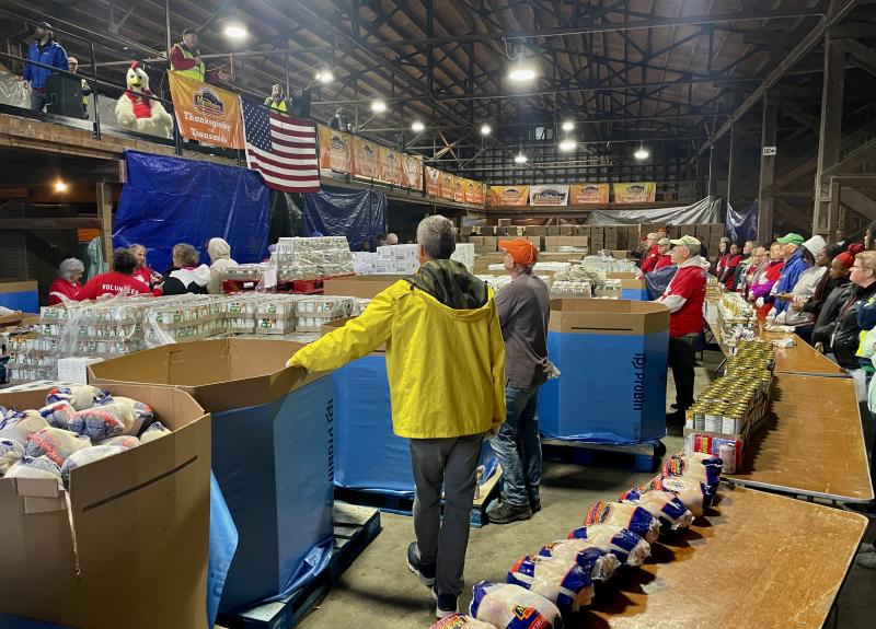 Volunteers do a countdown before starting the annual Easter for Thousands food box donation project.